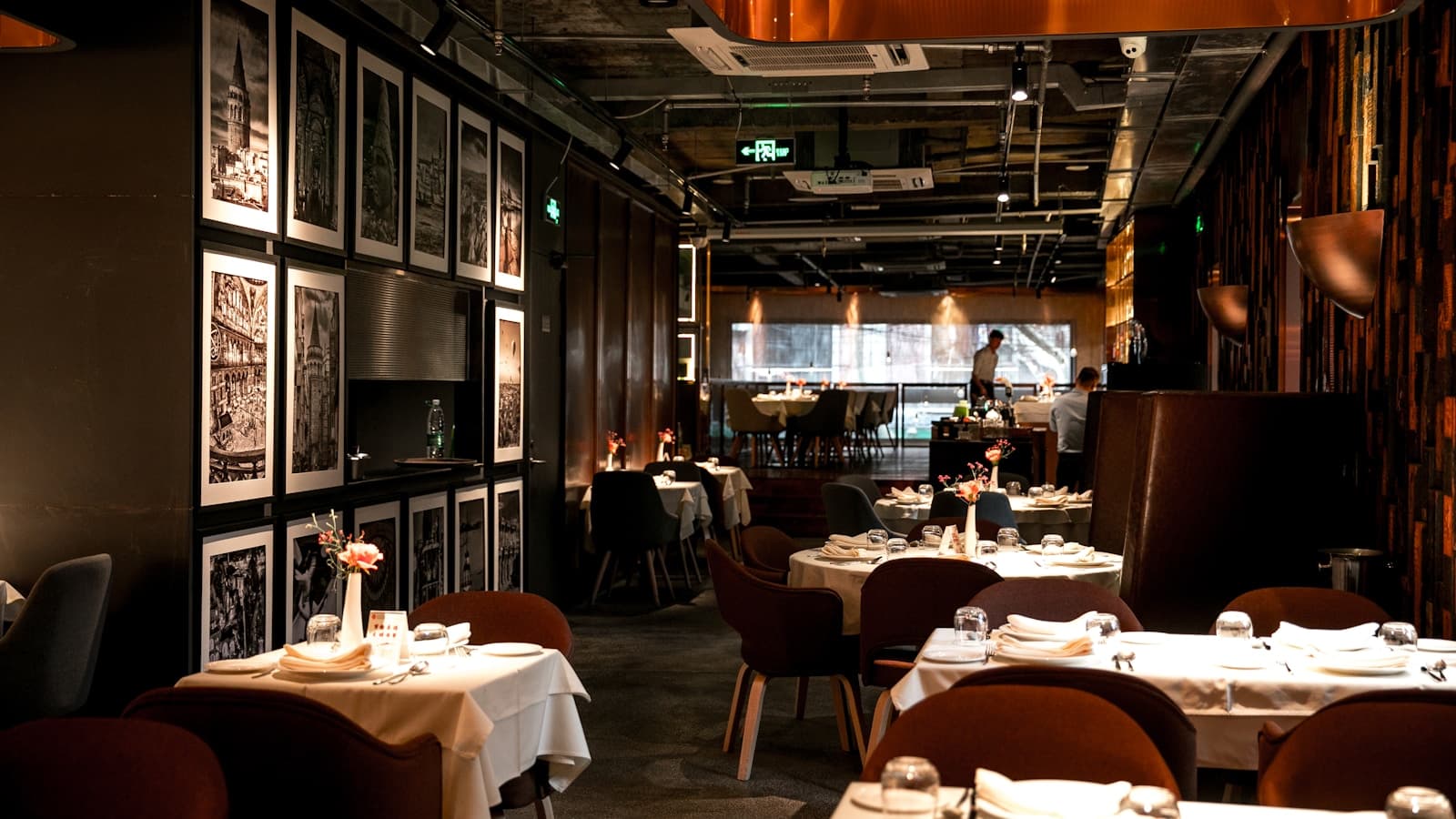 An upscale restaurant dining room interior with set tables.