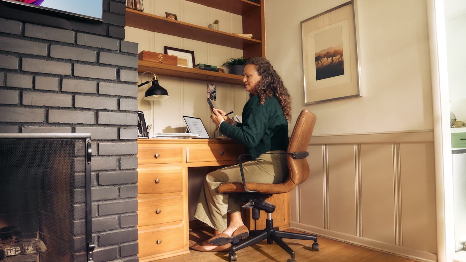 A newly finished built-in home office nook with wood desk and shelving.