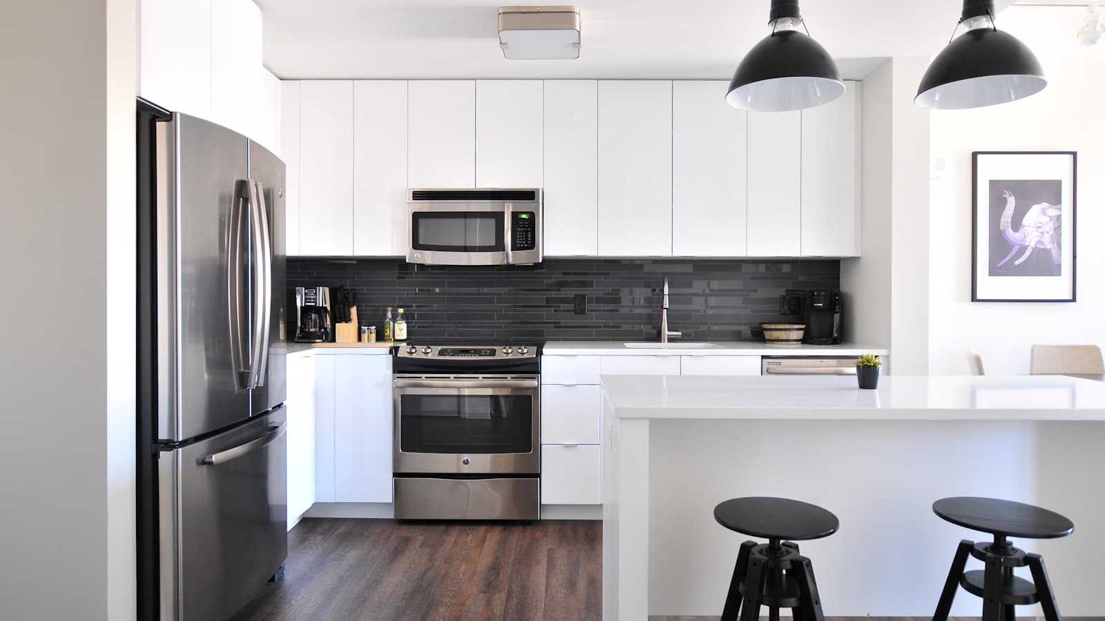 A modern stainless refrigerator in a home kitchen.
