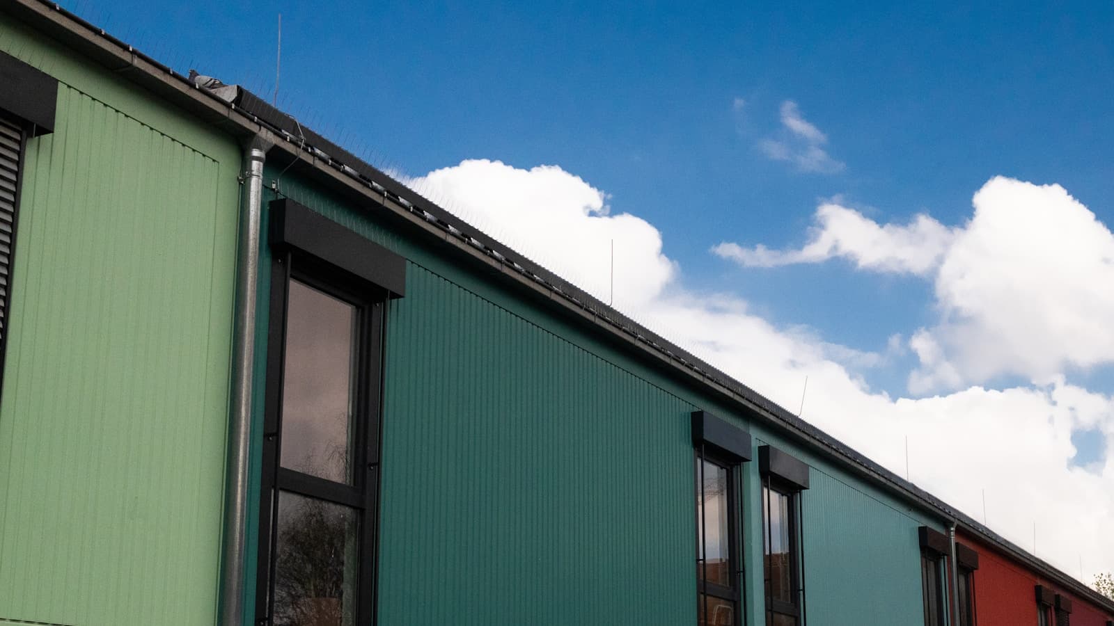 A colorful modular building complex with staggered panel-clad units.