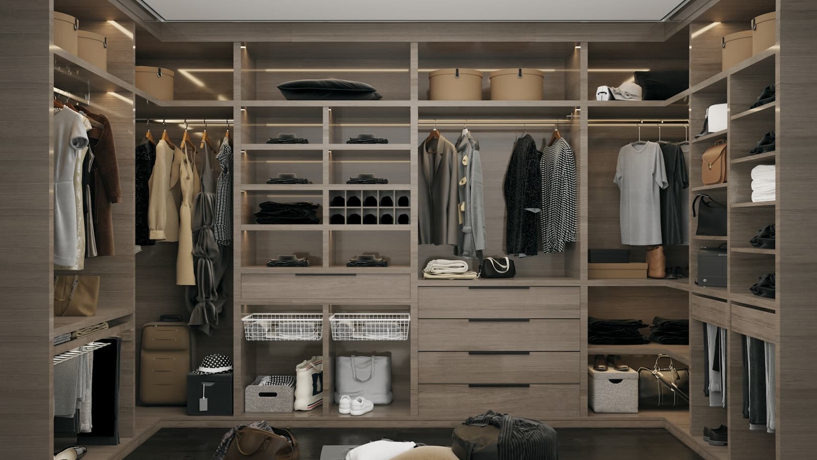 A neatly organized, modern walk-in closet with folded clothes and labeled bins.