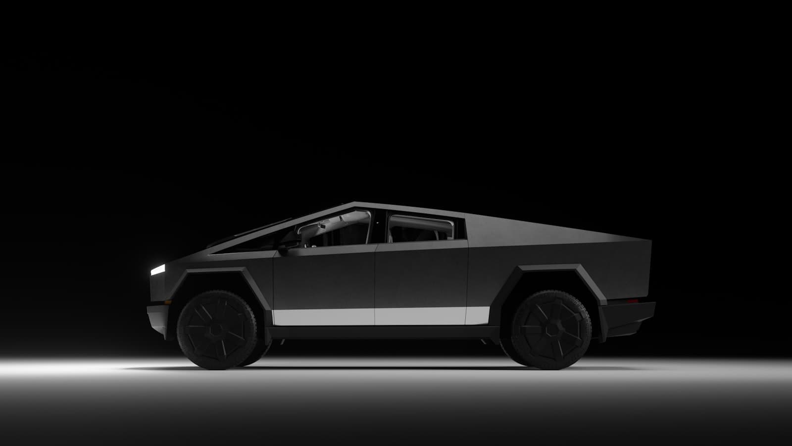 An angular, Cybertruck-style matte-gray electric pickup truck shown in profile against a plain black studio background.