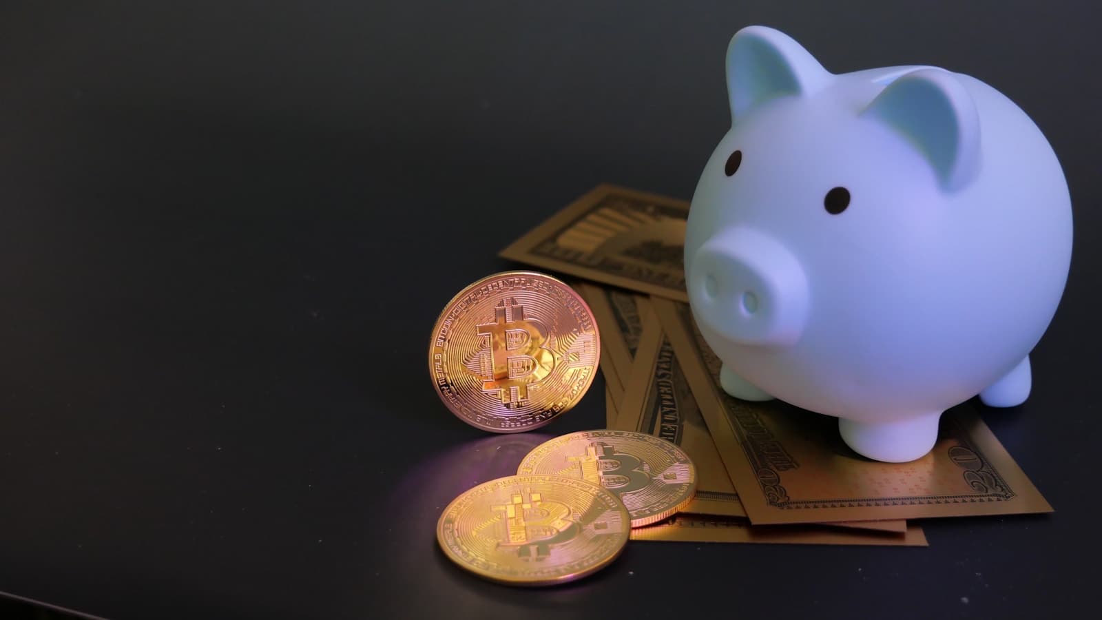 A white piggy bank sitting on top of folded cash, dark modern background.
