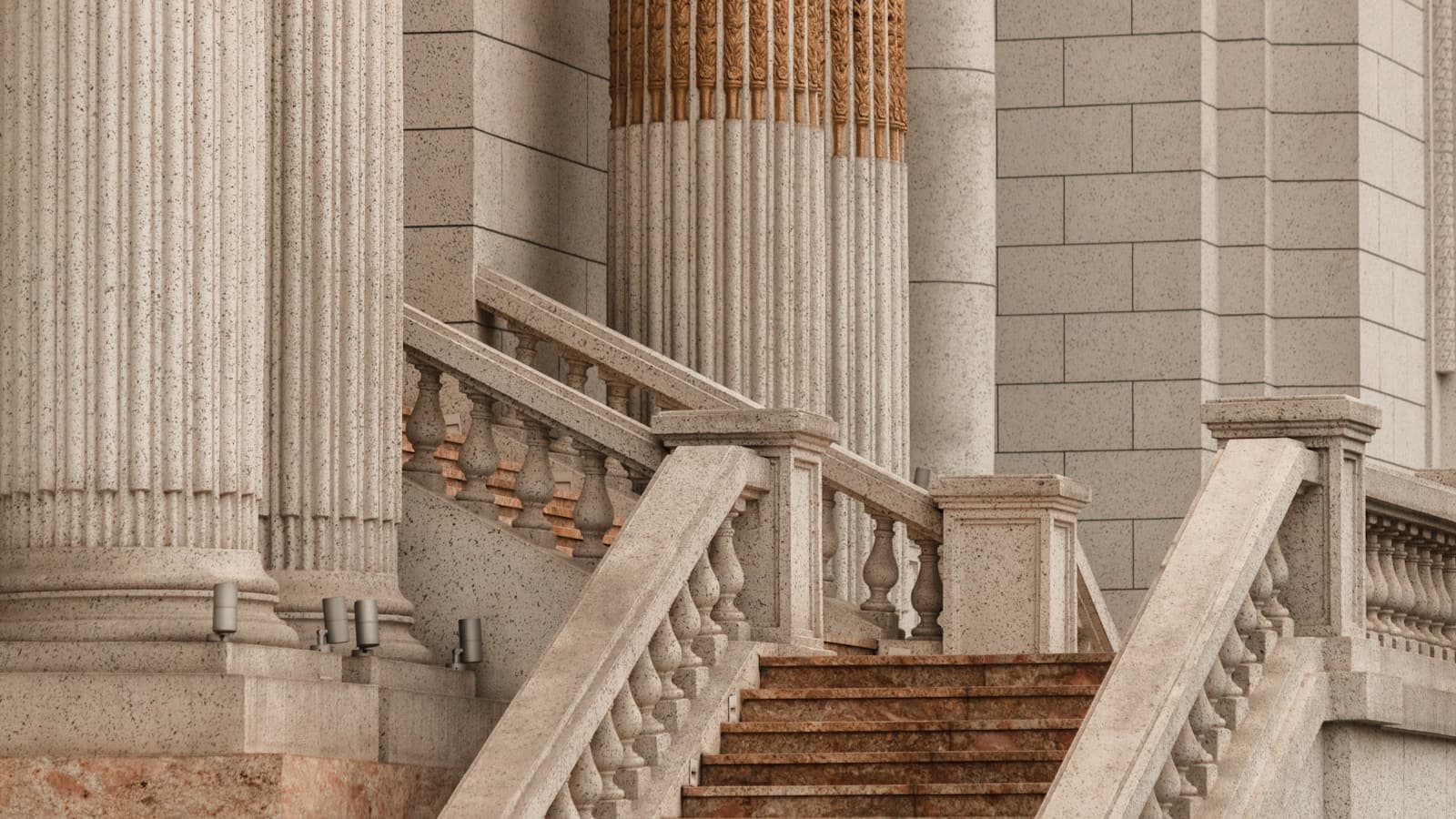 A grand stone staircase flanked by classical columns, courthouse-style exterior.